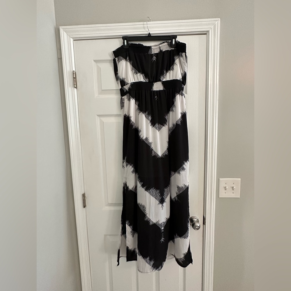 Sleeveless black and white floor length dress with slits